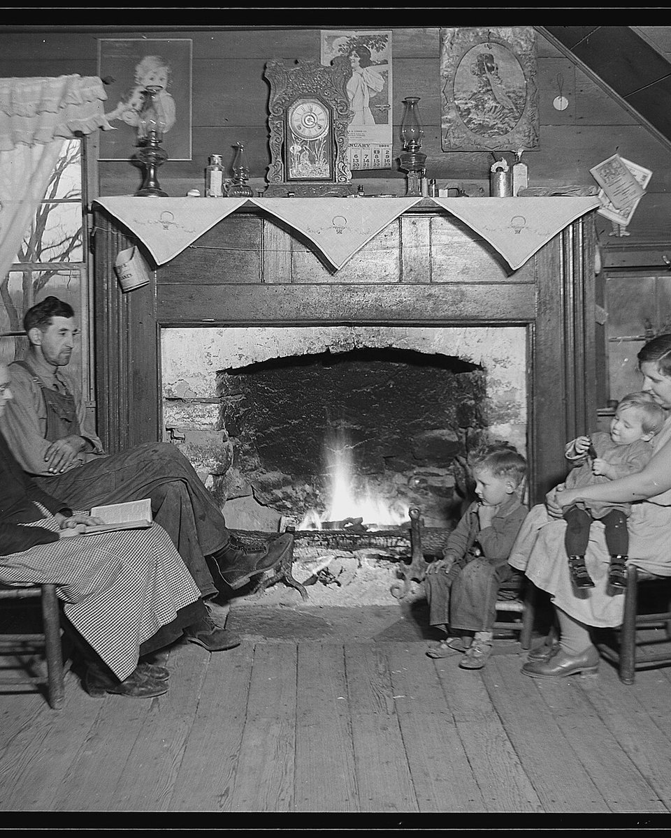 BEFORE: a black-and-white family group by a fireplace, with faded faces and cracked paper